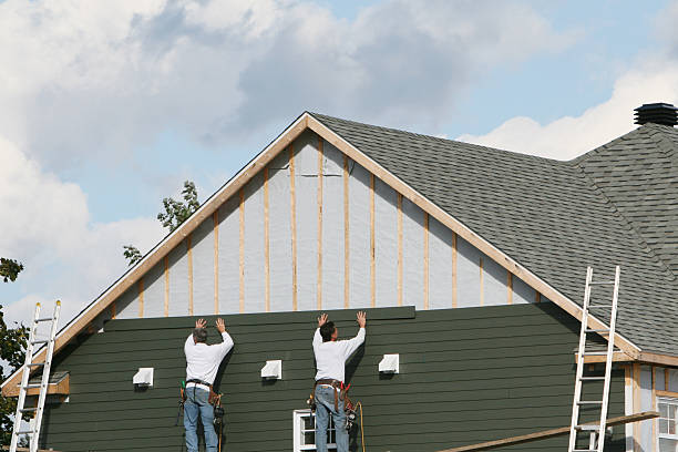 Professional Storm Damage Siding Repair technician working in Eastlake, OH
